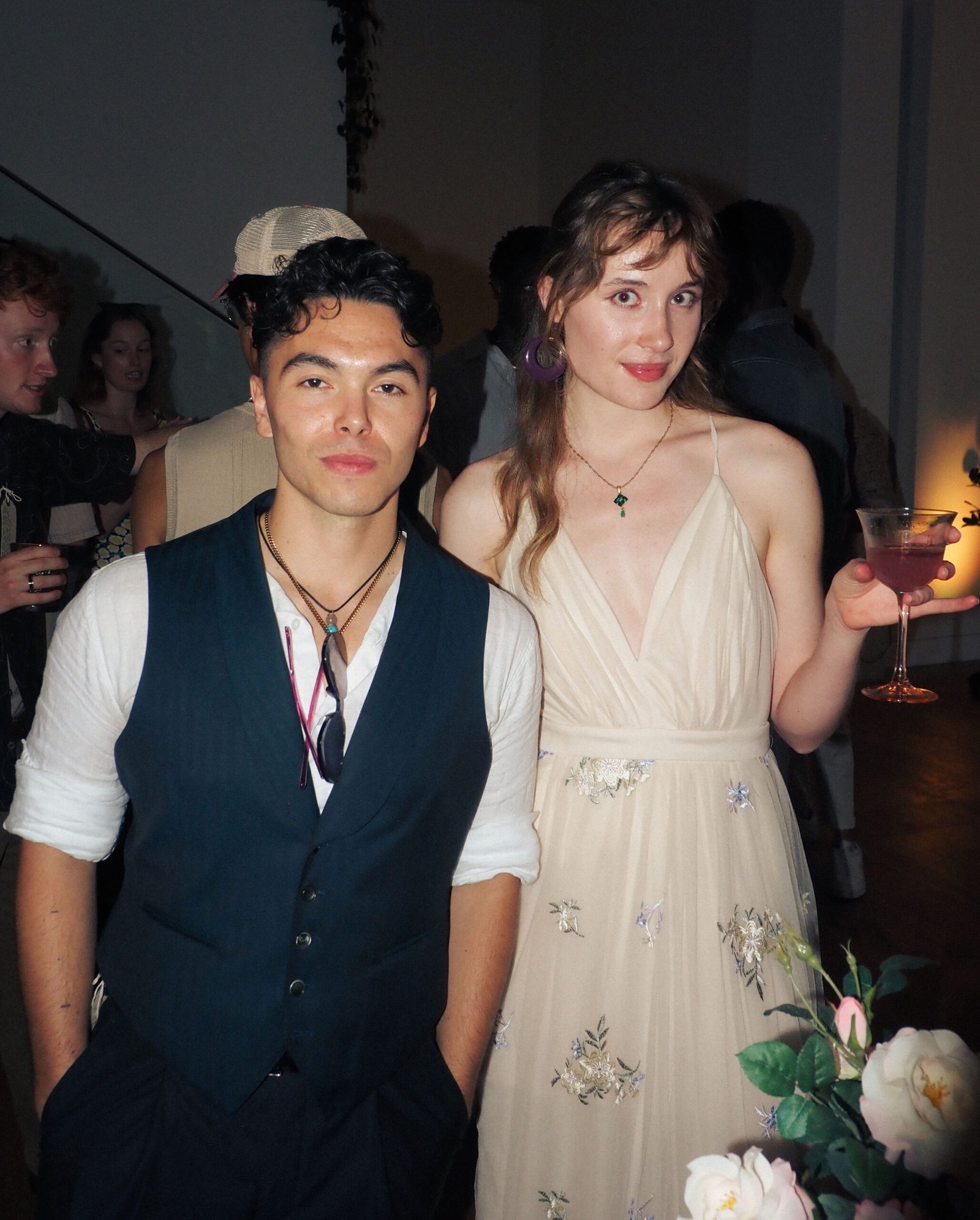 Guests in conversation under warm lighting